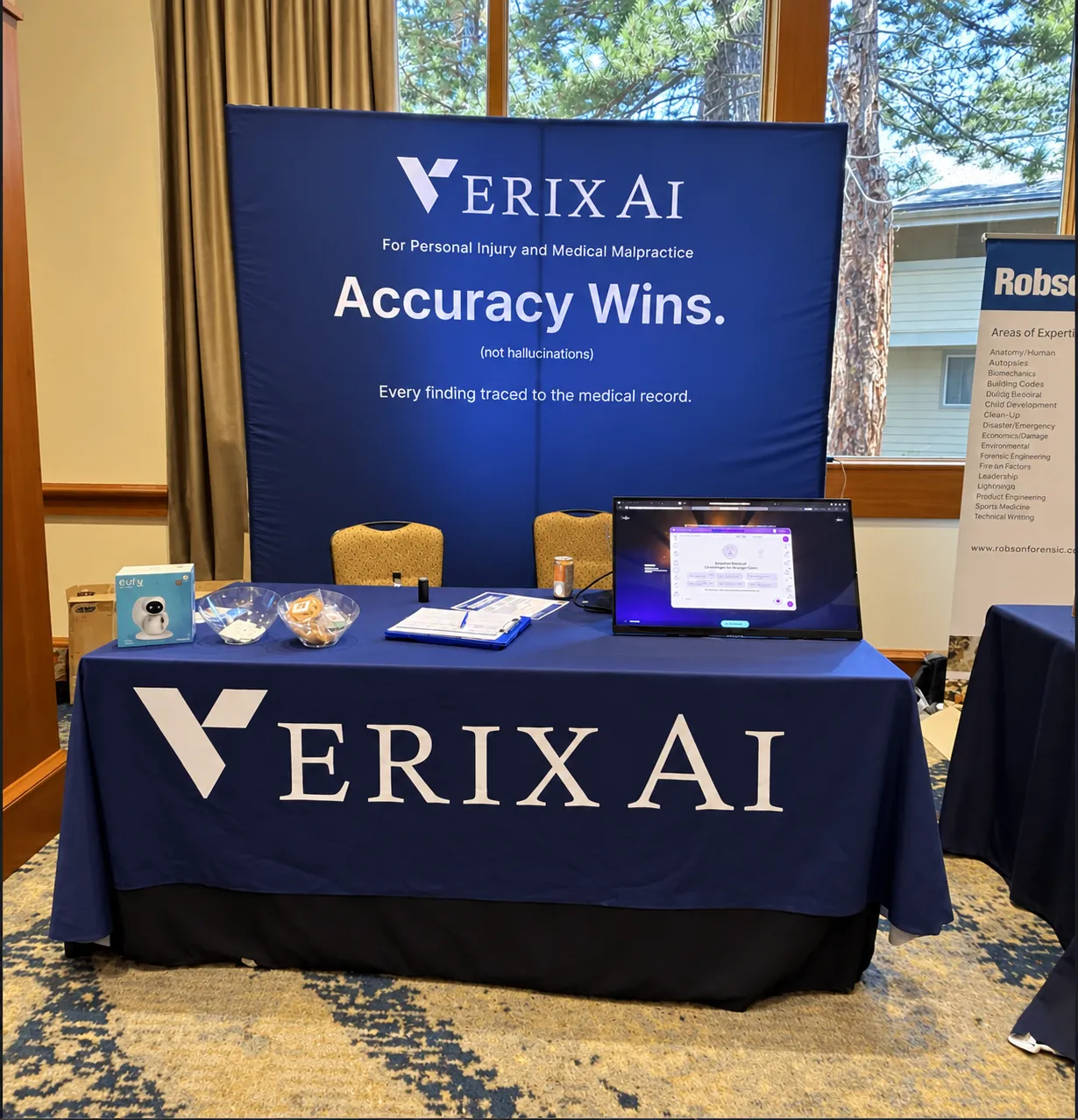 VerixAi conference booth with the headline Accuracy Wins, not hallucinations